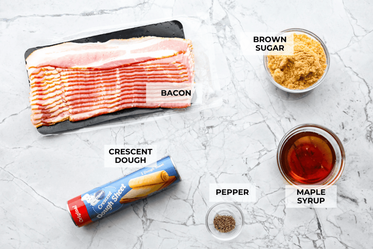 Maple Bacon Crack is as delicious and addicting as it sounds! It has flaky pastry dough drizzled in a sweet maple sauce and is loaded with crispy bacon pieces! It's the perfect sweet and salty snack! Overhead shot of labeled ingredients.