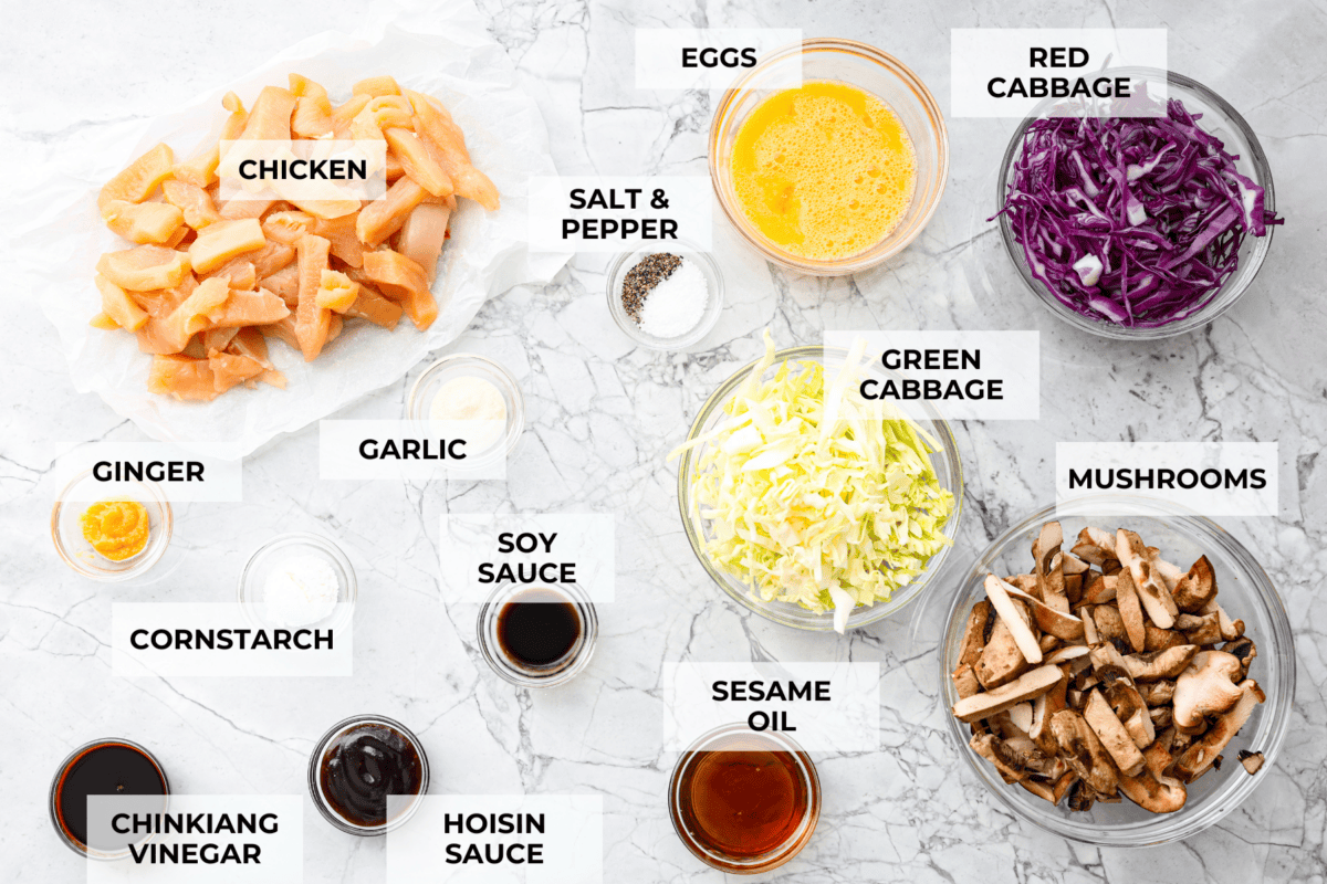 Moo Shu Chicken is a takeout favorite that’s so easy to make at home! This flavorful dish combines tender strips of chicken, mushrooms, and cabbage with a sweet and savory sauce. It’s quick, packed with vibrant flavors, and the perfect weeknight meal! Overhead shot of labeled ingredients.