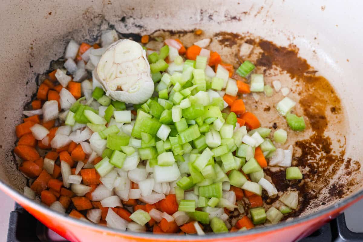Tender braised short ribs will fall off the bone and leave you speechless! Seared then cooked in a red wine reduction, beef broth, and fresh herbs. Every bite is tender perfection and will melt in your mouth! Fourth photo of the vegetables cooking.