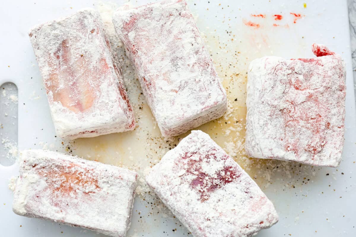 Tender braised short ribs will fall off the bone and leave you speechless! Seared then cooked in a red wine reduction, beef broth, and fresh herbs. Every bite is tender perfection and will melt in your mouth! Second photo of the short ribs coated in flour.