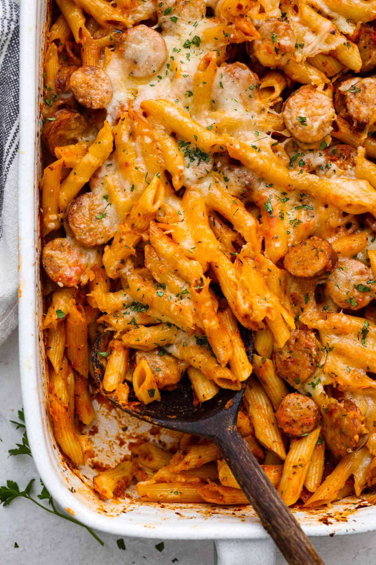 This one-pan Italian Sausage Casserole is the ultimate comfort food! With tender pasta, flavorful sausage, rich marinara, and gooey melted cheese, it’s an easy dinner that’s perfect for busy nights. It's a recipe the whole family will love! Overhead shot of Italian sausage casserole.
