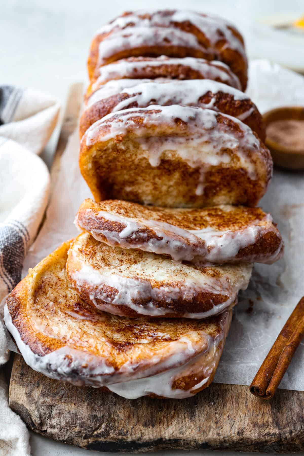 Irresistible Cinnamon Pull-Apart Bread is inspired by the popular cinnamon bread served at the Grist Mill eatery in Dollywood. With this copycat version, you can recreate that buttery, sweet deliciousness easily with frozen rolls. Angle shot of cinnamon pull-apart bread out of the loaf pan.
