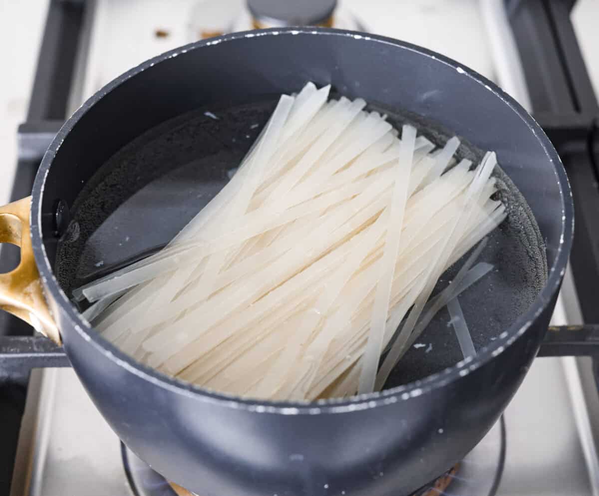 This simplified version of Vietnamese noodle soup brings the comforting flavors you love in Pho but with less effort. For a truly authentic experience, donโt miss out on this detailed recipe! Overhead shot of the noodles boiling in a pot.