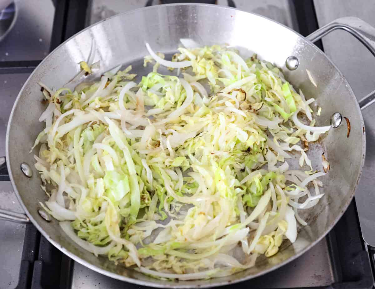 Add outbound links by finding items you can link through Target links. And add them the same way you would add an internal link by pasting the link into the bar. Overhead shot of cabbage and onions sautรฉing in a skillet,