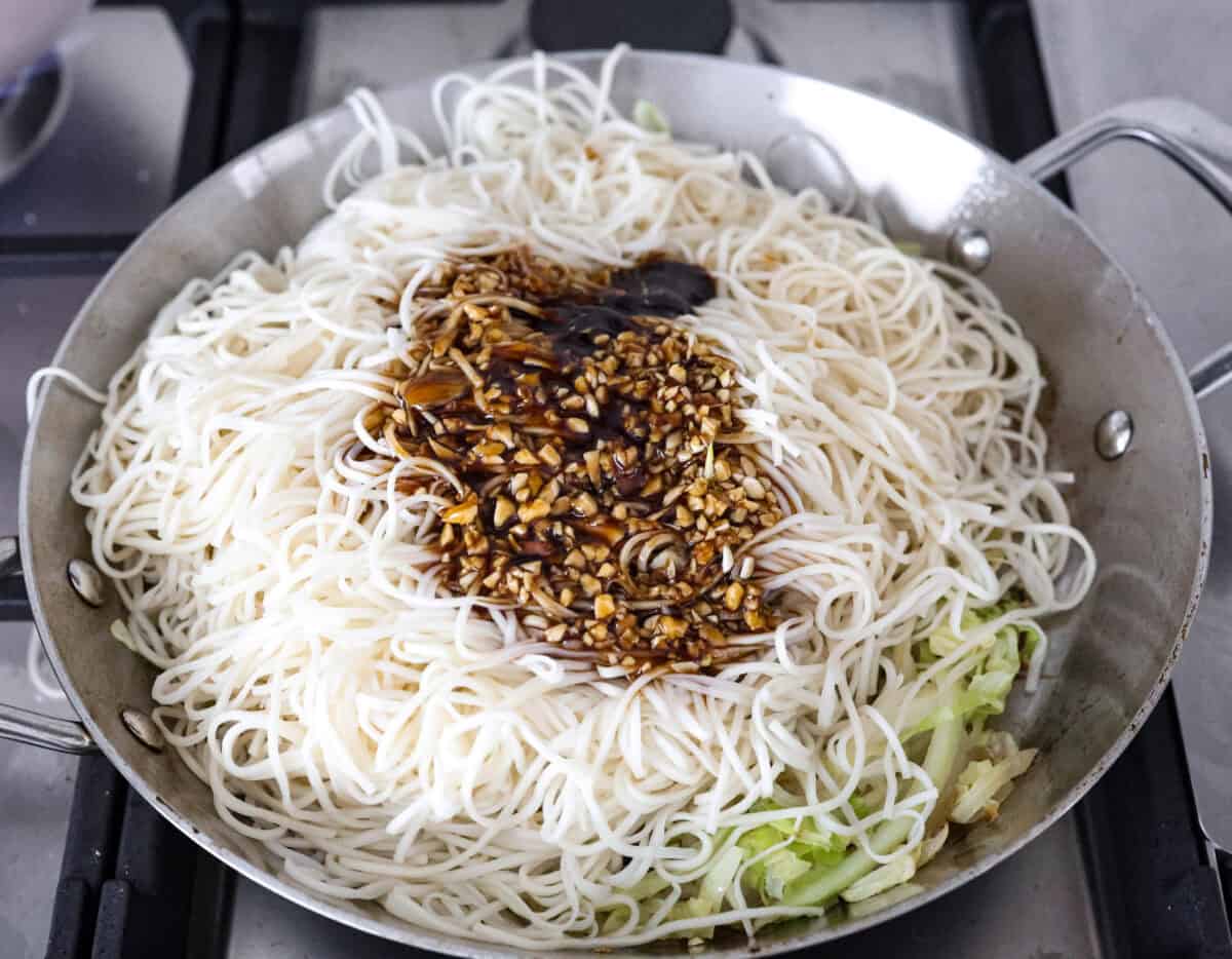 Add outbound links by finding items you can link through Target links. And add them the same way you would add an internal link by pasting the link into the bar. Overhead shot of low mein noodles, sauce and vegetables all in a skillet.