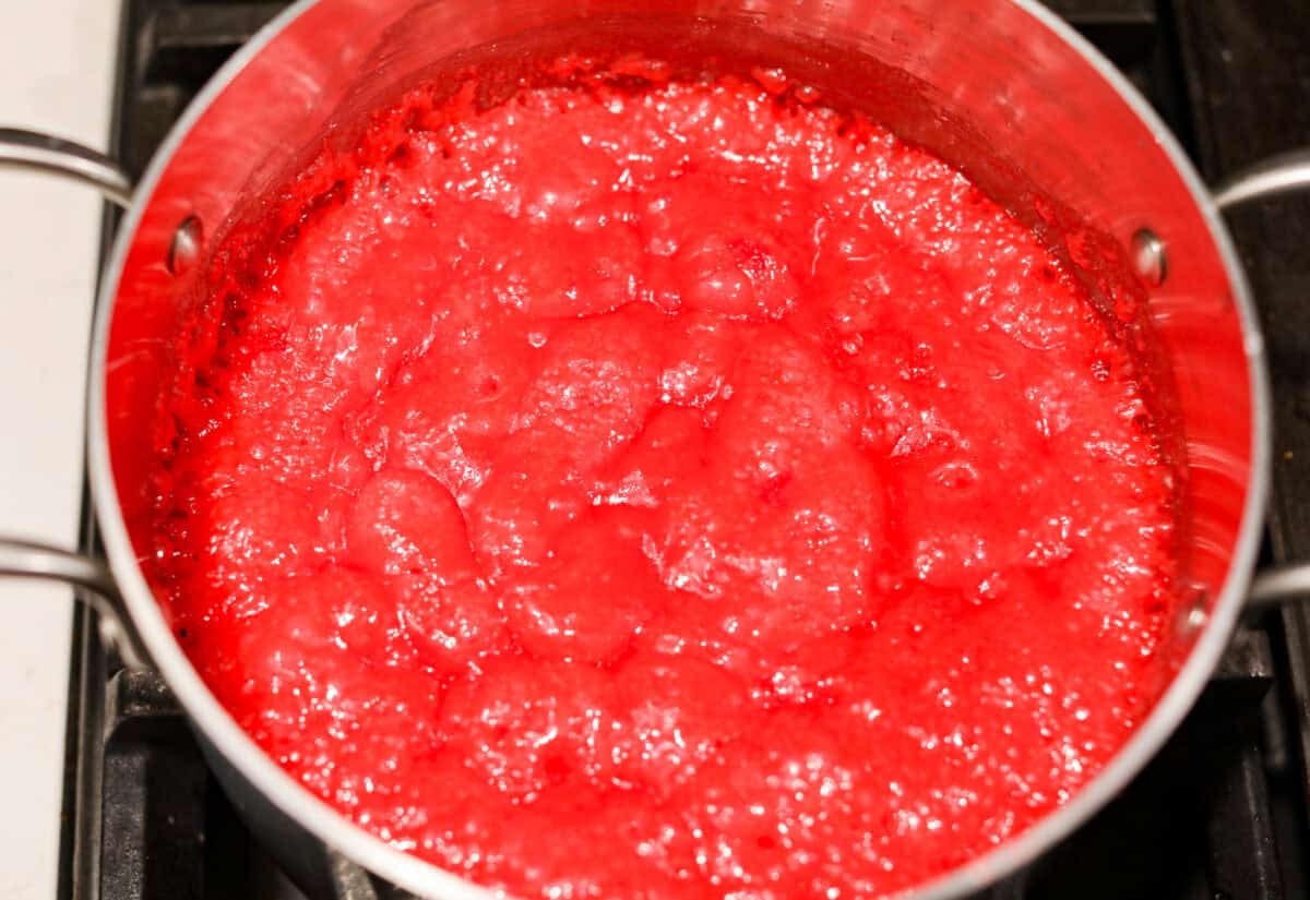 red hots candy Overhead shot of candy and butter mixture simmering in a pot.