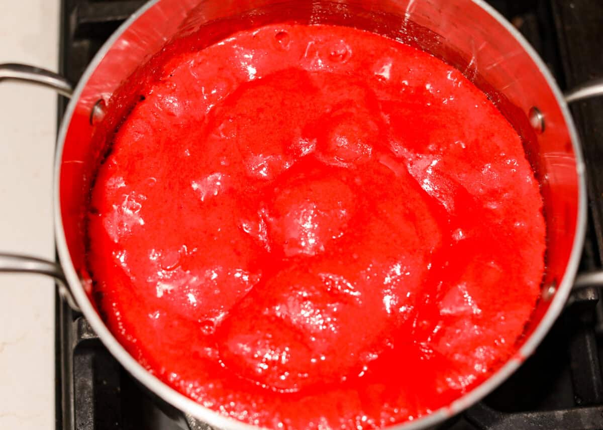 red hots candy Overhead shot of the candy and butter mixture in a pot with baking soda added to it.
