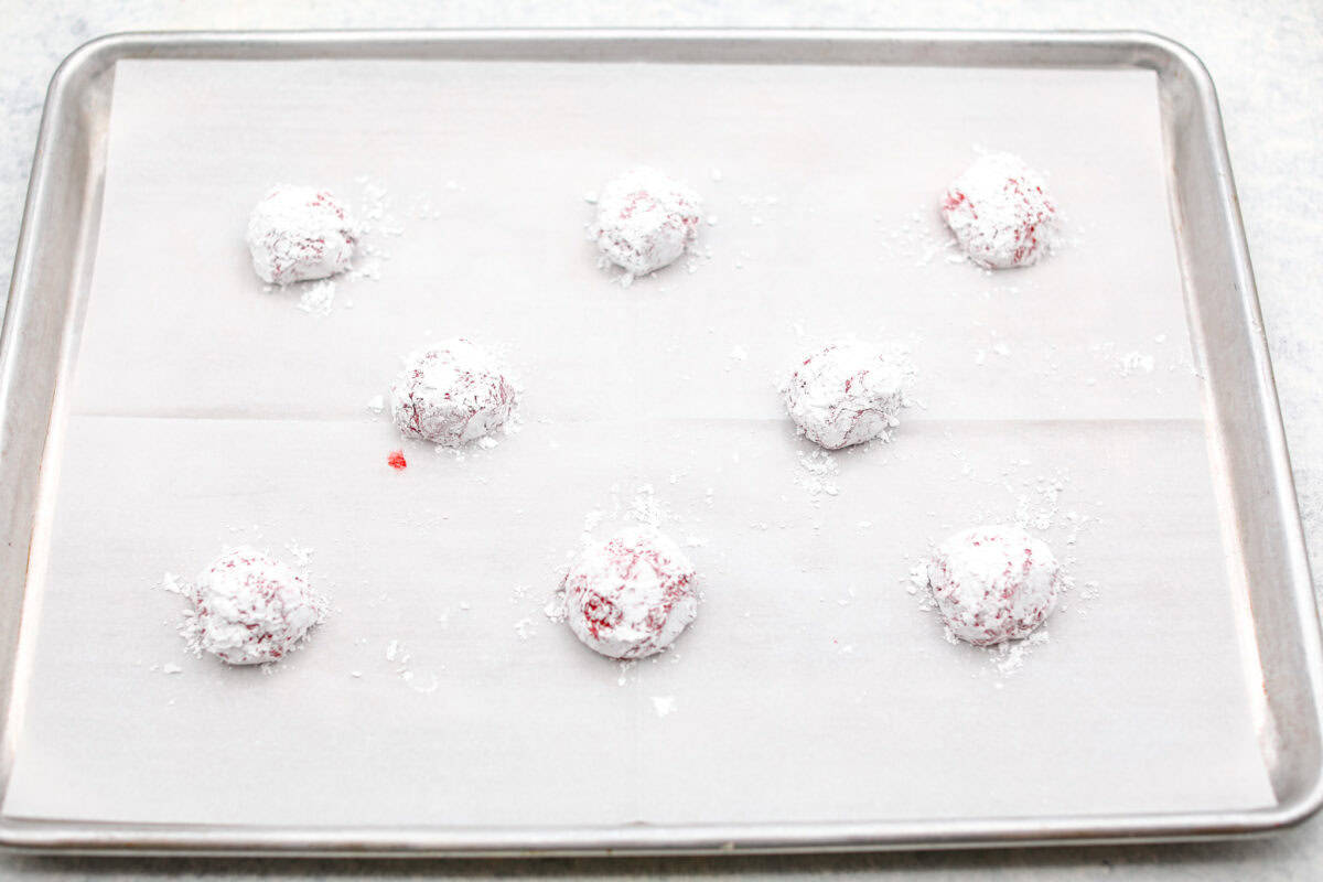 Gorgeous Cool Whip Cookies are made with just 4 simple ingredients! They bake up soft, fluffy, and bursting with flavor. Perfect for last-minute treats or when you’re craving something sweet without the fuss! Angle shot of powdered cookie dough ready to be baked on the prepared baking sheet.
