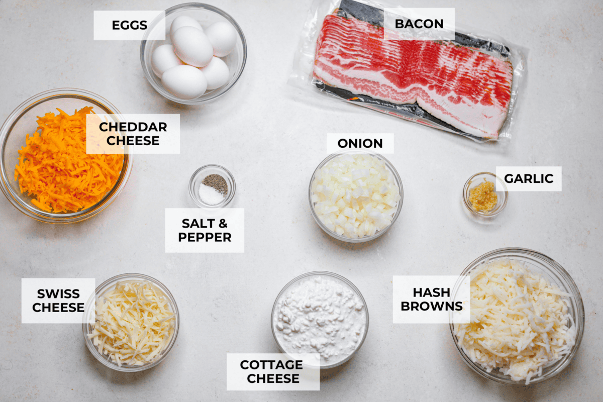 Kickstart your day with this hearty Amish Breakfast Casserole! It's loaded with crispy bacon, tender hash browns, and gooey melted cheese. This dish is a crowd-pleaser thatโs perfect for family breakfasts and holiday mornings! Overhead shot of labeled ingredients.