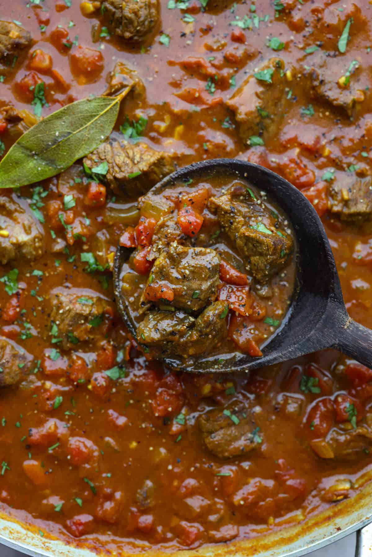 Comforting beef curry is a perfect blend of hearty and flavorful! With its mild spice level, it’s a dish that everyone can enjoy, but you can easily turn up the heat with a pinch of red pepper. Pair it with rice or naan for the ultimate cozy dinner! Close up shot of beef curry.
