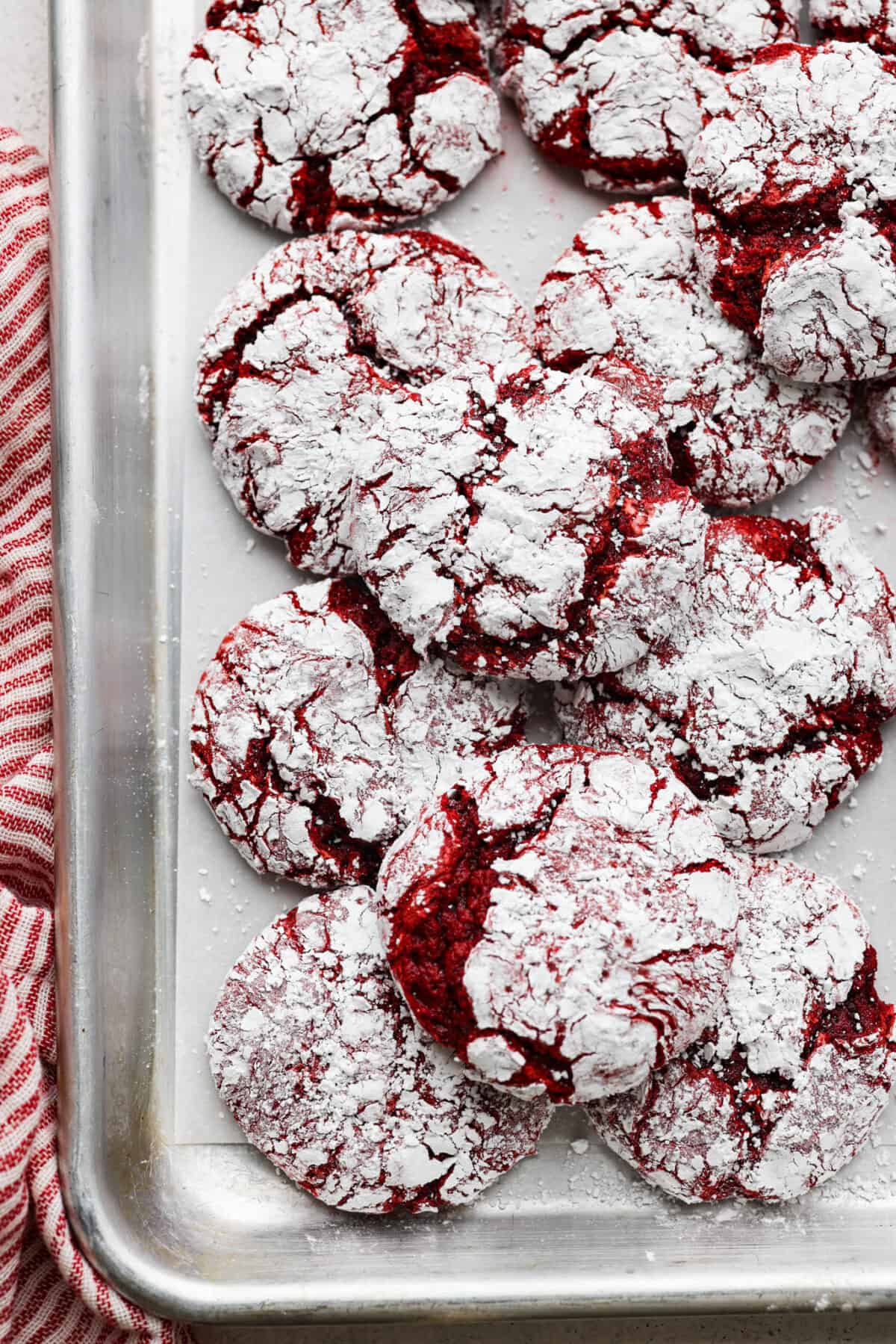 Gorgeous Cool Whip Cookies are made with just 4 simple ingredients! They bake up soft, fluffy, and bursting with flavor. Perfect for last-minute treats or when you’re craving something sweet without the fuss! Overhead shot of cool whip cookies stacked on a baking sheet.