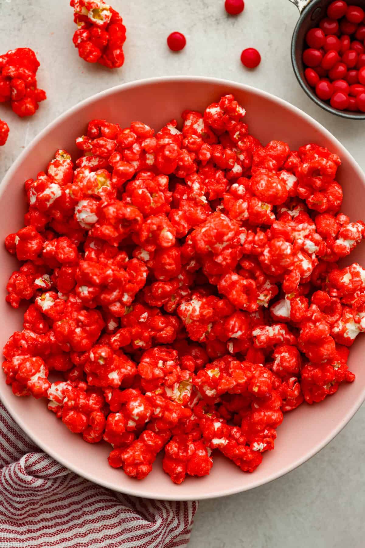 red hots candy Overhead shot of red hot cinnamon popcorn in a bowl.