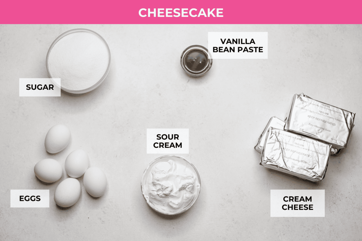 Creme Brulee Cheesecake is the perfect merging of two beloved desserts! It has the rich, creamy texture of cheesecake with the caramelized sugar topping of classic crรจme brรปlรฉe. This irresistible treat is the best of both worlds! Overhead shot of labeled creme brรปlรฉe cheesecake ingredients.