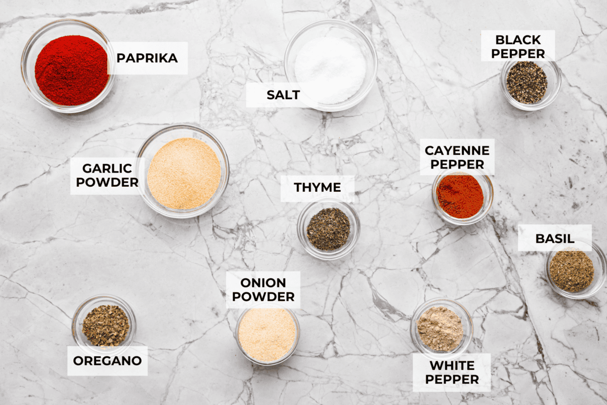 Creole seasoning is a bold and flavorful spice blend that brings the lively taste of Louisiana to your kitchen! It has the perfect balance of herbs, spices, and a touch of heat. It adds depth to everything from gumbo and jambalaya to roasted veggies and seafood. Overhead shot of labeled ingredients.