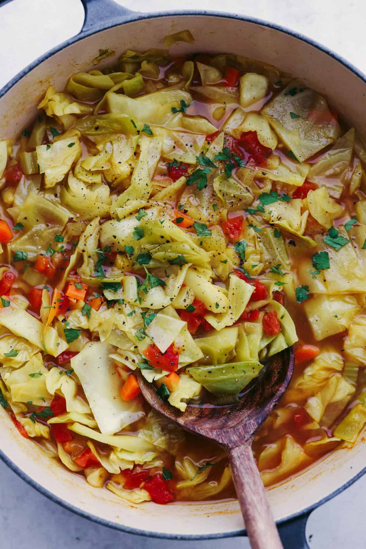 This Detox Cabbage Soup is the perfect way to kick off your New Year's resolutions! After indulging over the holidays, this soup will give you the kick-start you need to feel better. It's loaded with fresh veggies and essential vitamins and is super budget-friendly.