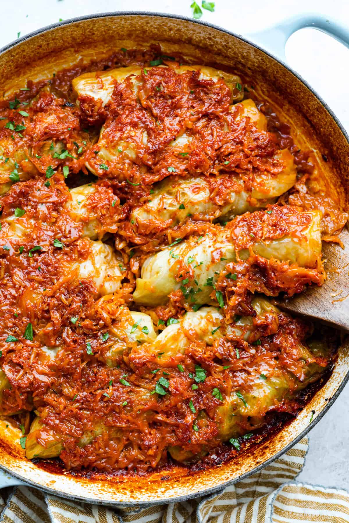 Hungarian cabbage rolls are packed with rich, hearty flavors in every bite! I know you love a good cabbage roll and can’t get enough of my Hungarian goulash, so I knew this recipe would be perfect. Overhead shot of the cooked Hungarian cabbage rolls in teh dutch oven.