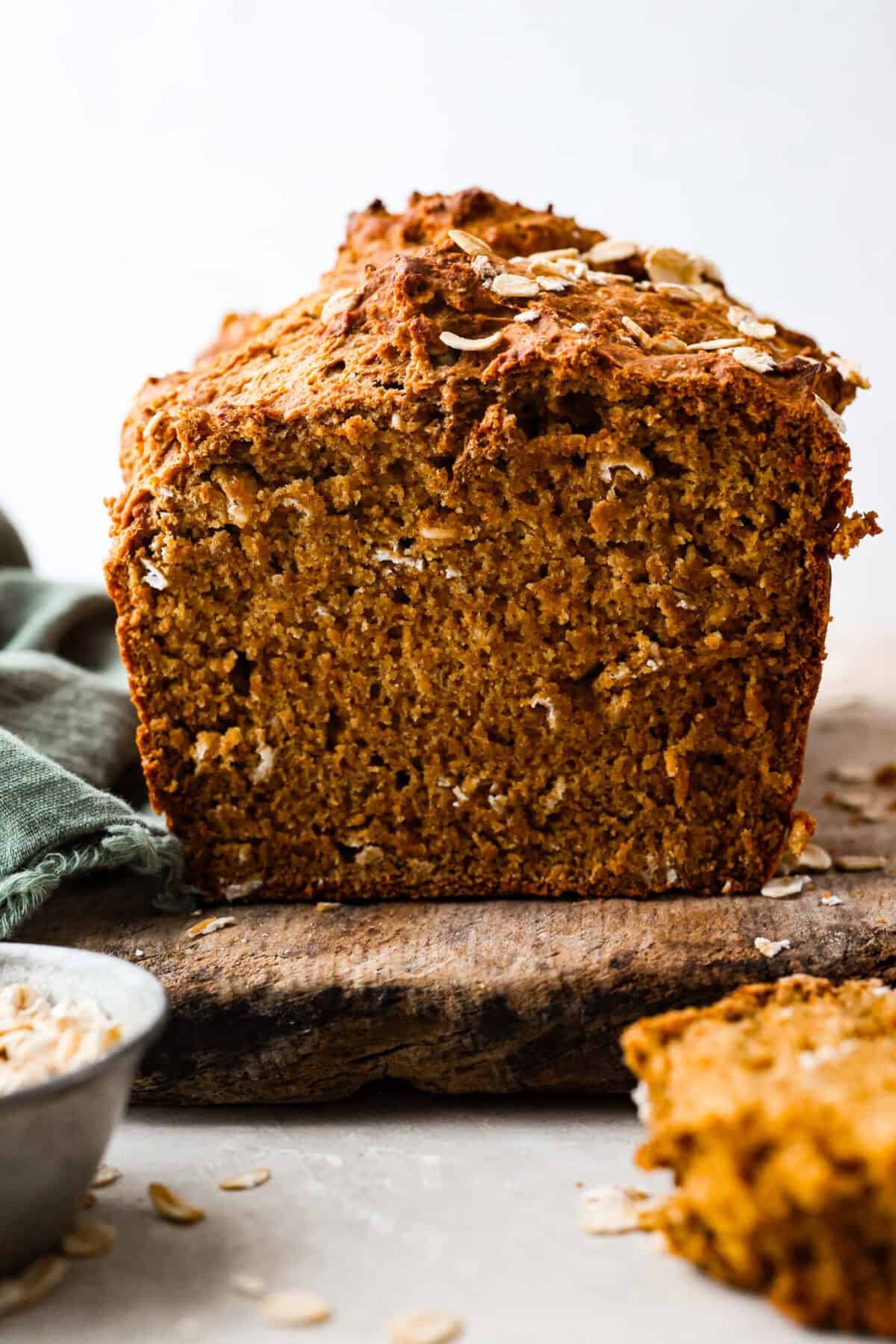 Irish Brown Bread is a delicious twist on classic soda bread, offering a slightly sweet, rich, and hearty flavor. It comes together quickly and makes a great breakfast, snack, or side with dinner. It's so yummy with honey, butter, or jam! Close up shot of a cut loaf of Irish brown bread.