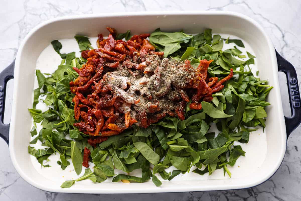 You all love my Crockpot Tuscan Chicken, and I know casseroles are a favorite as well. So, I combined them into this irresistibly delicious Tuscan Chicken Casserole! Casserole ingredients all in the baking dish.
