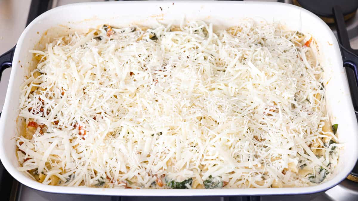 You all love my Crockpot Tuscan Chicken, and I know casseroles are a favorite as well. So, I combined them into this irresistibly delicious Tuscan Chicken Casserole! Cheese added to the top of the casserole.