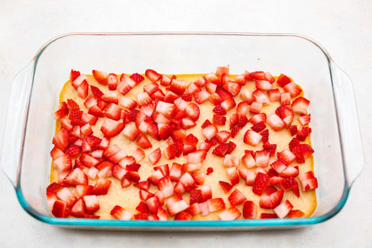 My Strawberry Delight is the ultimate summer showstopper! Buttery crust, juicy strawberries, sweet jello, and fluffy toppingโone bite and everyoneโs hooked. Fresh cut strawberries on top of the crust layer.