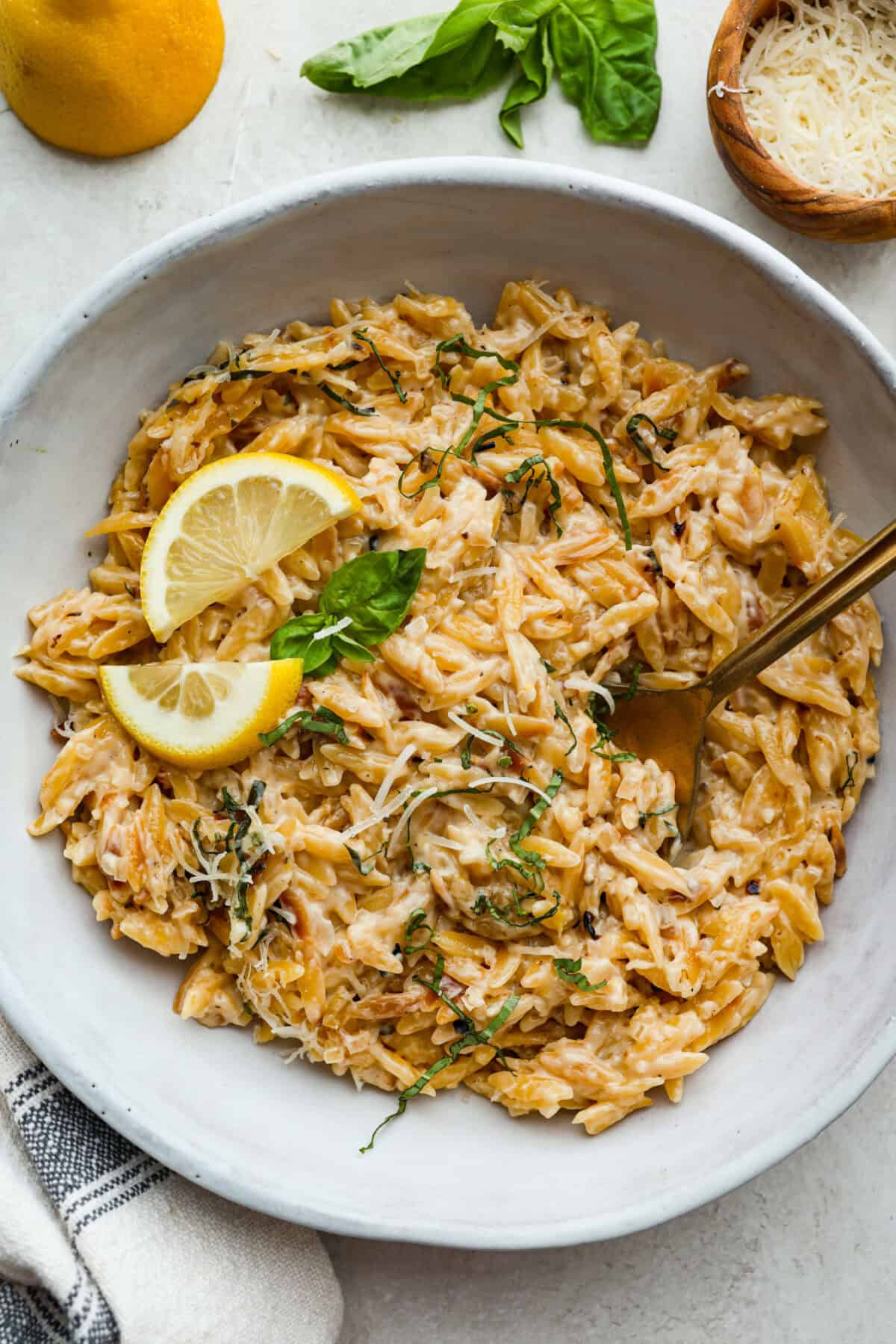 Overhead shot of plated creamy lemon orzo. 