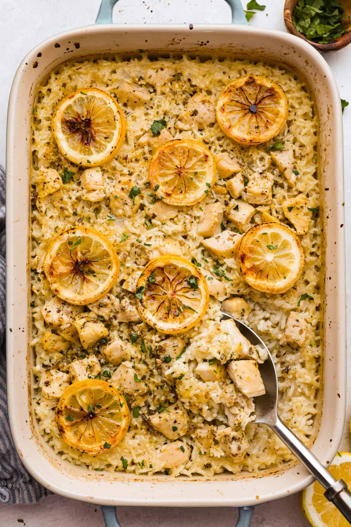 Overhead shot of baked lemon chicken casserole in a baking dish.  