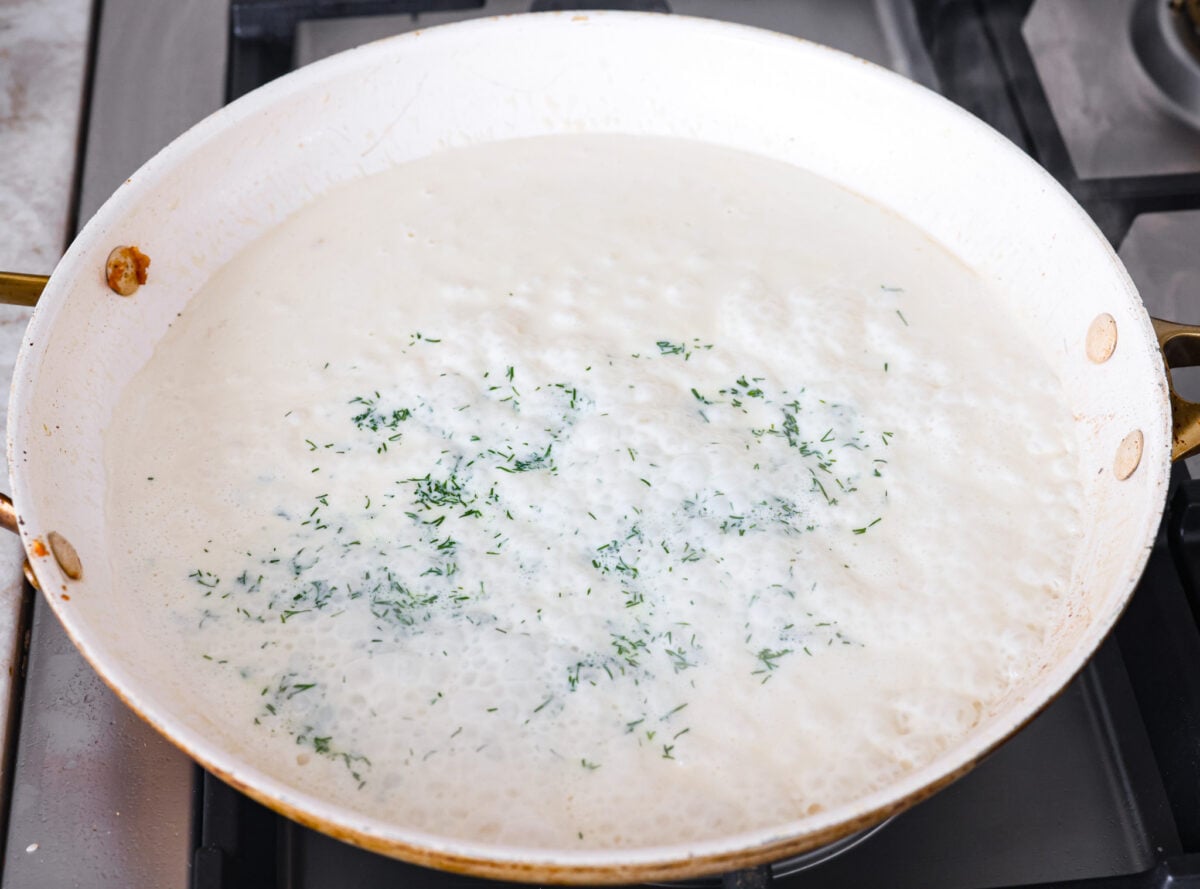 My Pan Seared Salmon has a new and improved Sauce! I added salt to bring out the flavors, and now it’s perfect! Fresh lemon juice and dill make it a match made in salmon heaven! Cornstarch mixture, fresh dill and lemon juice added to the cream sauce.