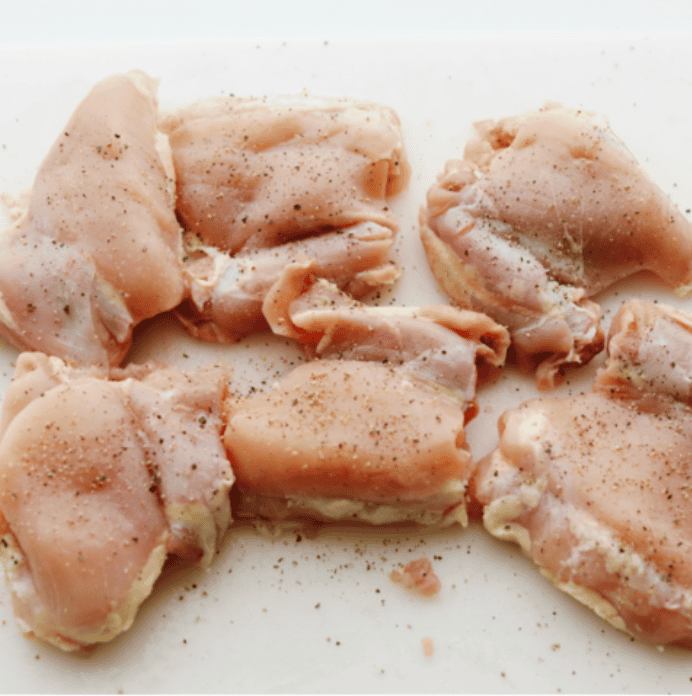 My Sticky Asian Glazed Chicken is one of those dinners I keep coming back to. Itโs sweet, a little savory, and full of flavorโbut honestly, itโs the caramelized glaze that seals the deal. It's SO GOOD! Seasoned chicken on a cutting board.