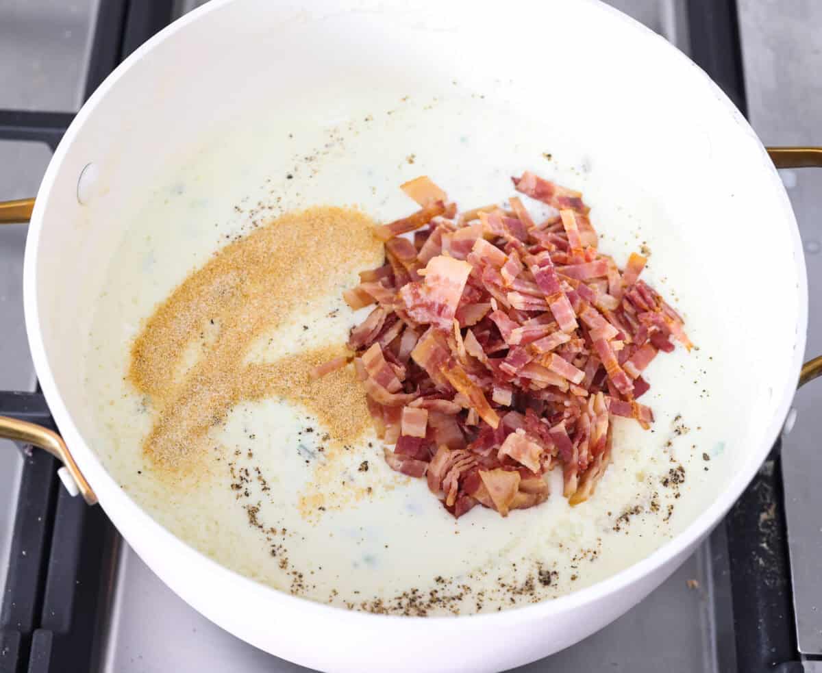 You guys, this Jalapeño Popper Mac and Cheese is downright sinful in the best way. Creamy, cheesy, spicy, and loaded with comfort food goodness! It’s easy to put together, and trust me, it’s so worth it! Bacon, and seasonings added to the cream and jalapeno mixture.