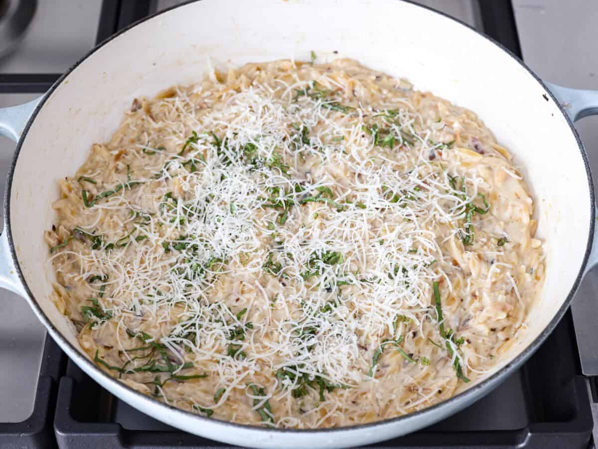 Fresh lemons make me so happy! They’re bright, cheerful, and lift me out of the winter rut. Add that citrusy sunshine to a creamy pasta, and you get this dreamy Creamy Lemon Orzo! Simple, rich, and bursting with feel-good flavor. Lemon juice, cream and other ingredients added to the orzo.