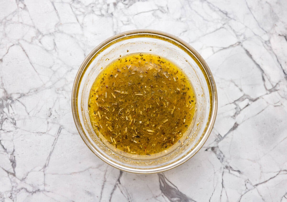 If there’s one side dish that never sticks around for long at my house, it’s these air fryer carrots! They’re crisp on the outside, tender inside, and seasoned to bring out all their natural sweetness—even the picky eaters love them! A top down shot of the bowl of dressing.