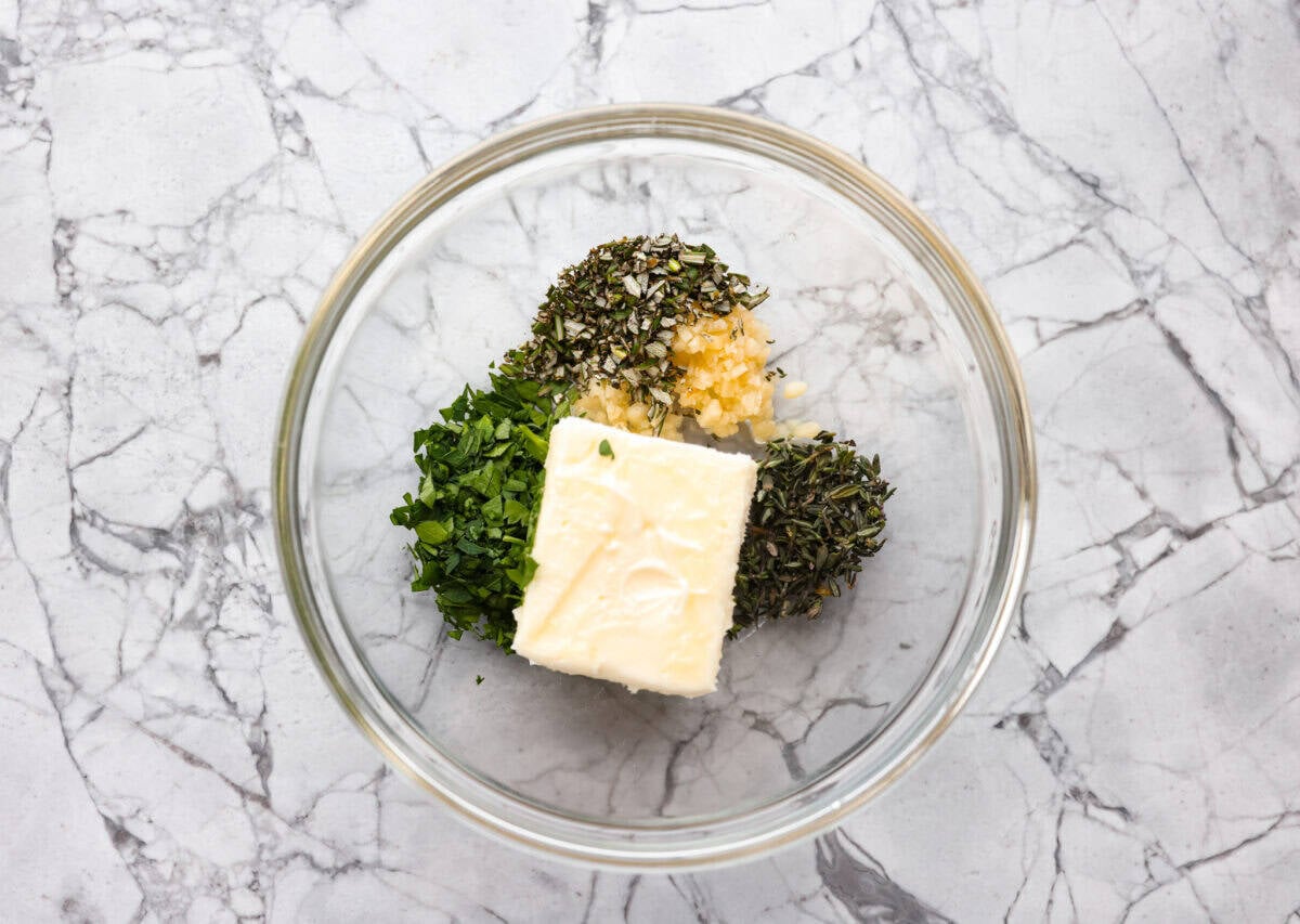 My Air Fryer Steak is a favorite around here for a reason! Itโs perfectly seared, super juicy, and so full of flavorโitโs my go-to way to make steak! Butter, herbs and garlic in a bowl.