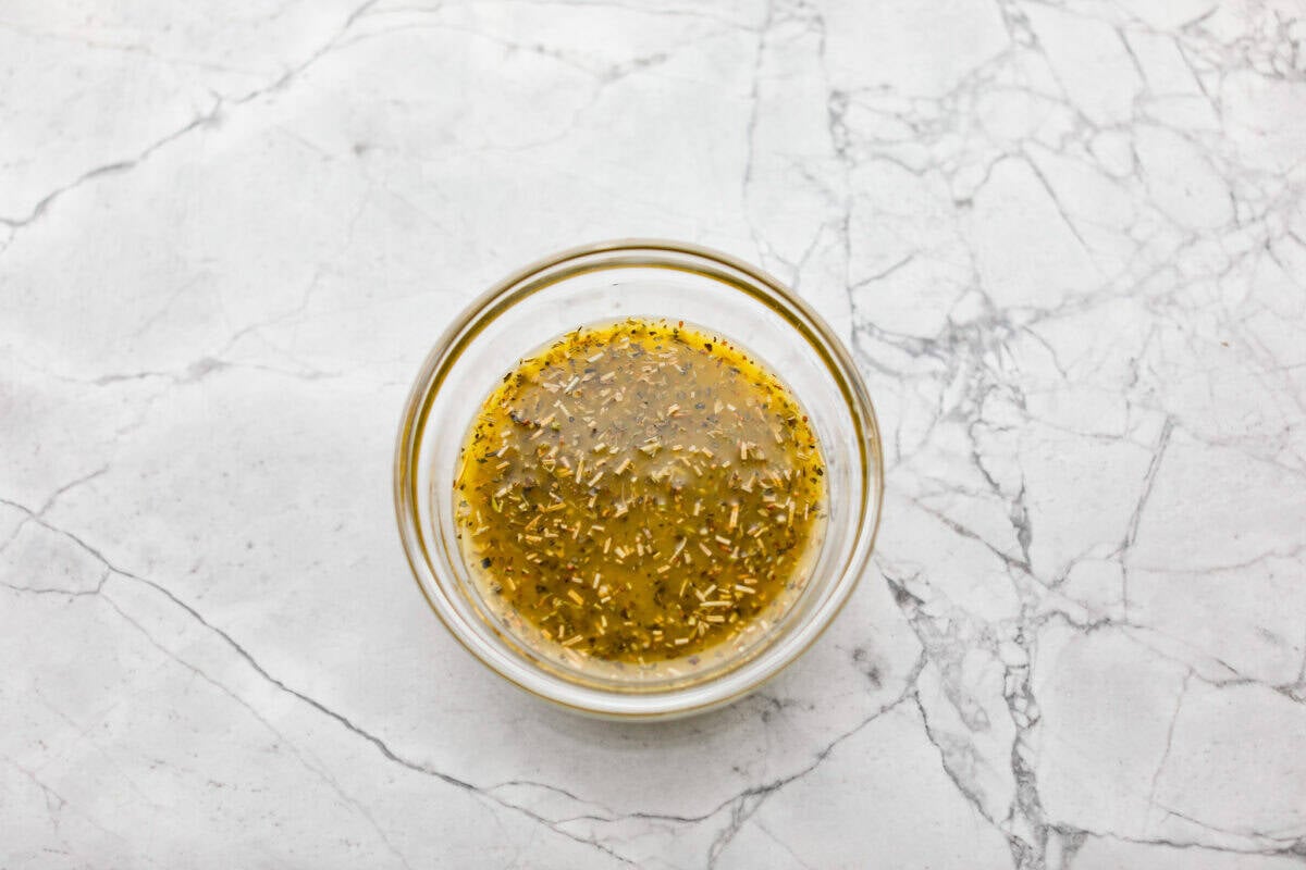 Okay, this antipasto salad? Itโs basically an Italian snack board in a bowl, and Iโmย obsessed! What makes this one a little different (and so good) is the easy lemony dressing. All of the dressing ingredients mixed together in a bowl.