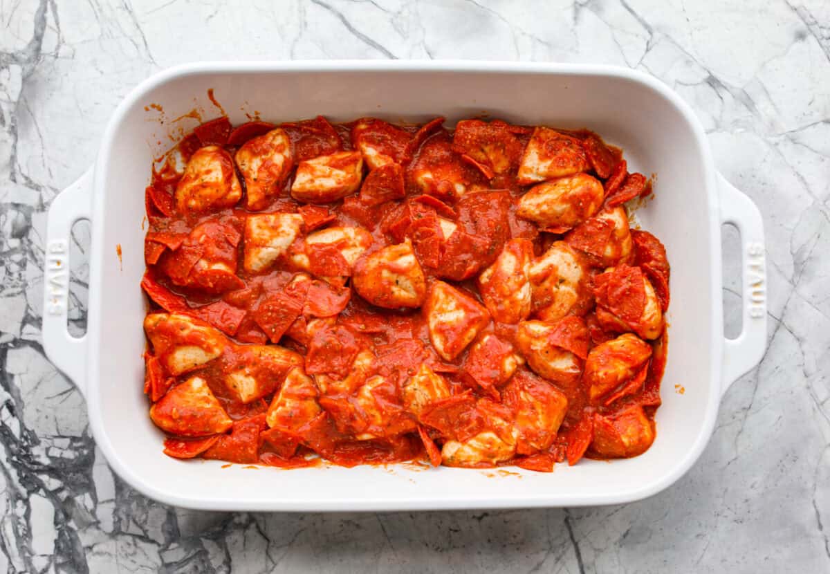 Bubble Pizza is what you make when you want something cozy, cheesy, and easy. Think pizza meets pull-apart bread with zero rolling, stretching, or takeout guilt. Ingredients all mixed together in a baking dish.