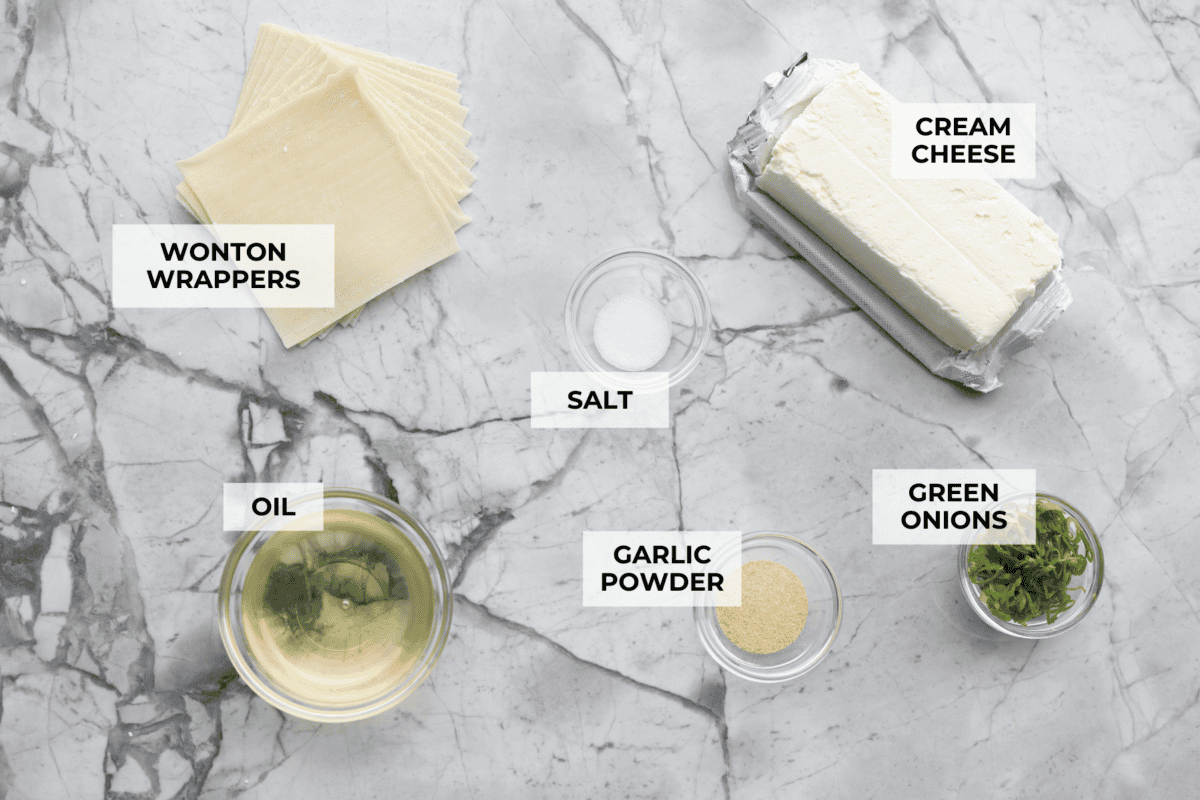 If you guys are as obsessed with cream cheese wontons as I am, you are going to love this easy-to-follow recipe! These crispy, creamy, wontons are totally doable! Overhead shot of labeled ingredients.