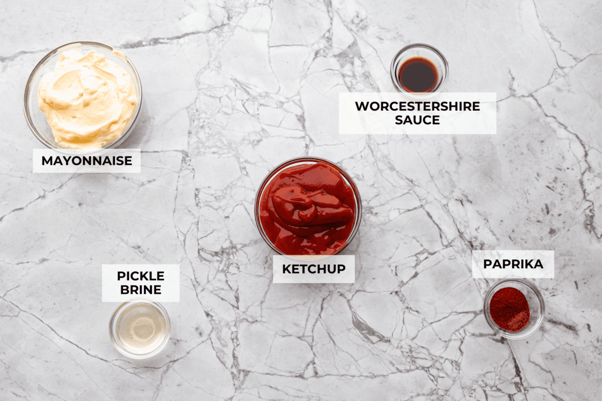 Born and raised in Utah—the true home of fry sauce—I’ve perfected this recipe to pair with just about everything. This isn’t your average ketchup-mayo mix. The secret ingredient? Pickle Brine. Stay with me! It brings the BEST tang to the sauce!! Overhead shot of labeled ingredients.