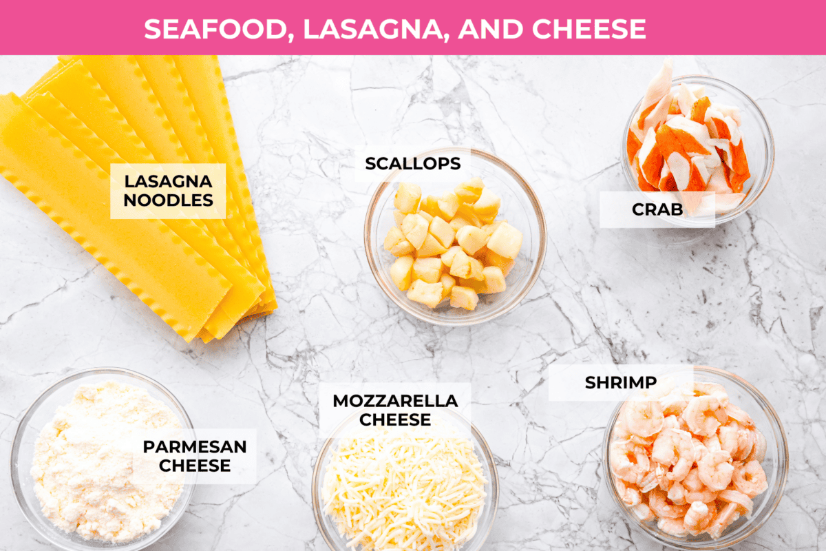 If youโre a seafood lover, you'll be obsessed with this Seafood Lasagna. Iโm talking crab, scallops, and shrimp in creamy, cheesy layers, baked to bubbly perfection. Itโs my go-to dinner when Iโm cooking for seafood fans! Overhead shot of labeled seafood lasagna ingredients.