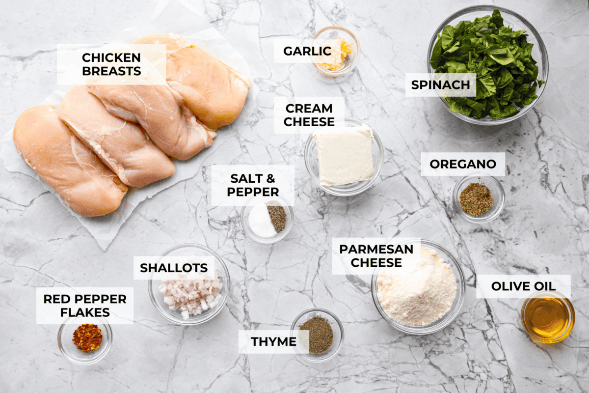 Do you love spinach dip as much as I do? My Spinach Stuffed Chicken Breast turns those creamy, cheesy flavors into an insanely delicious dinner. Quick, easy, and seriously so good. Overhead shot of labeled ingredients.
