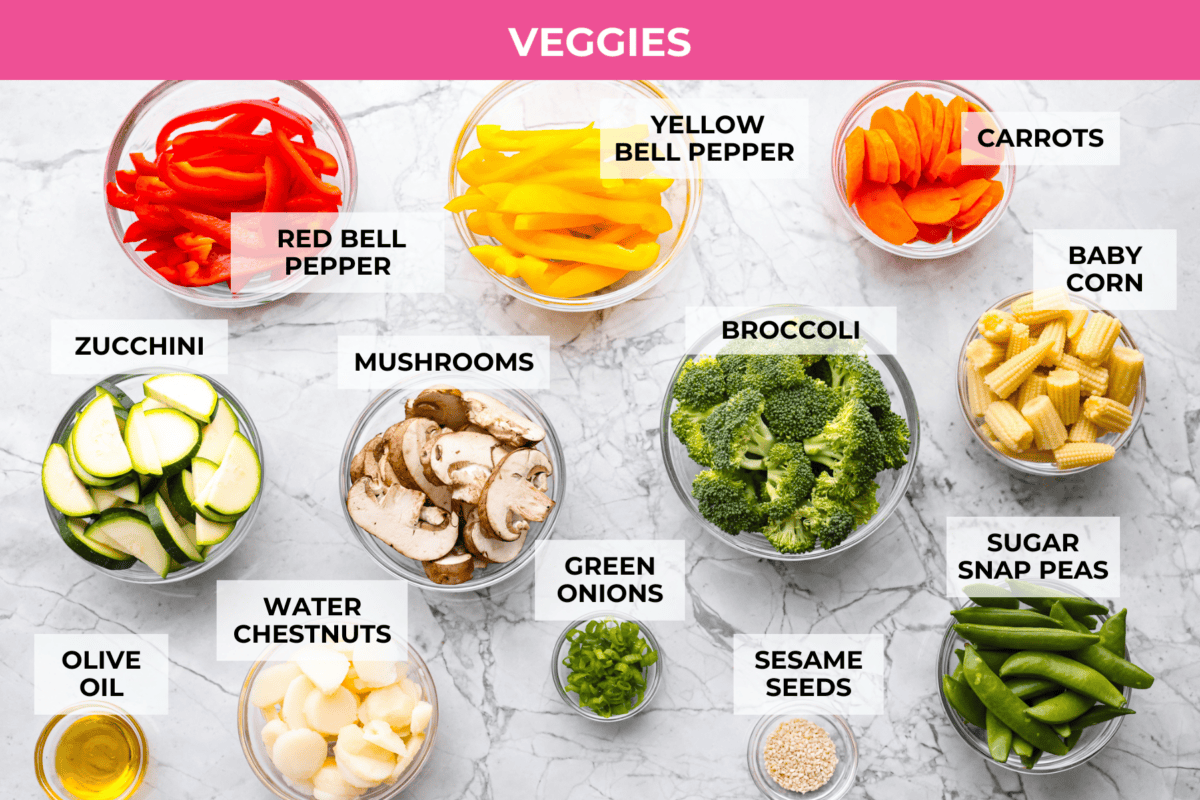 You all love this vegetable stir fry, and I donโt blame you. Itโs fast, flexible, and that sauce? So addicting! Toss in whatever veggies you have and dinnerโs done. Overhead shot of labeled veggies ingredients.