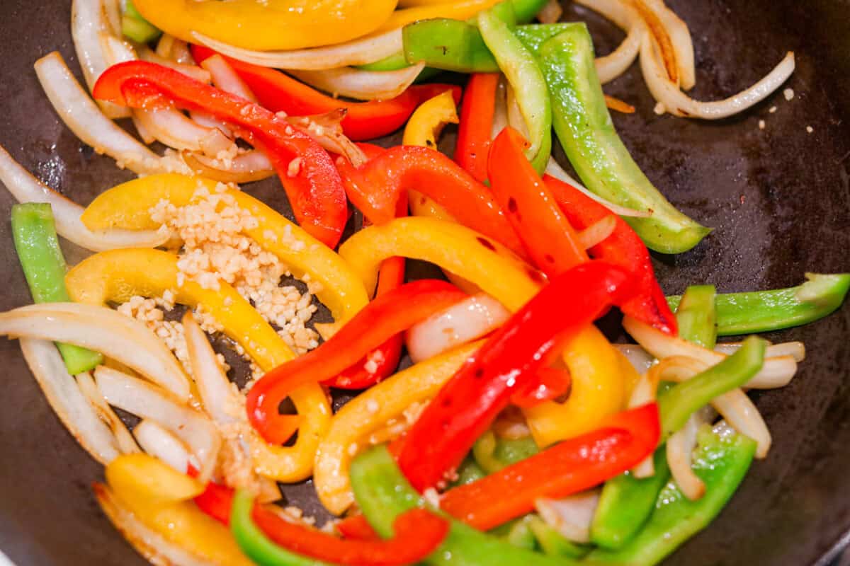 Apparently garlic fixes everything, and you knew it before I did. After a few of you suggested adding it to this Italian Sausage & Peppers, I gave it a tryโฆ and wow! Turns out, garlic takes this from good to seriously addictive. Garlic added to the cooked vegetables.