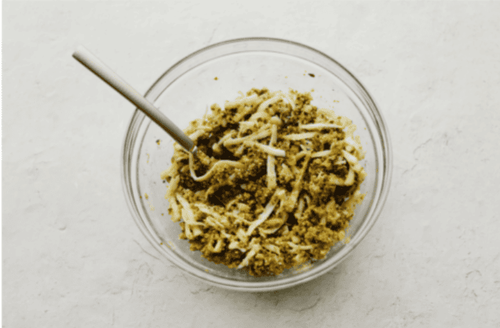 Stuffed pork chops sound fancy, but they’re super easy and budget-friendly. I’ll show you how to keep the pork chops moist and stuffed with gooey, cheesy deliciousness! Overhead shot of filling mixture in a bowl.