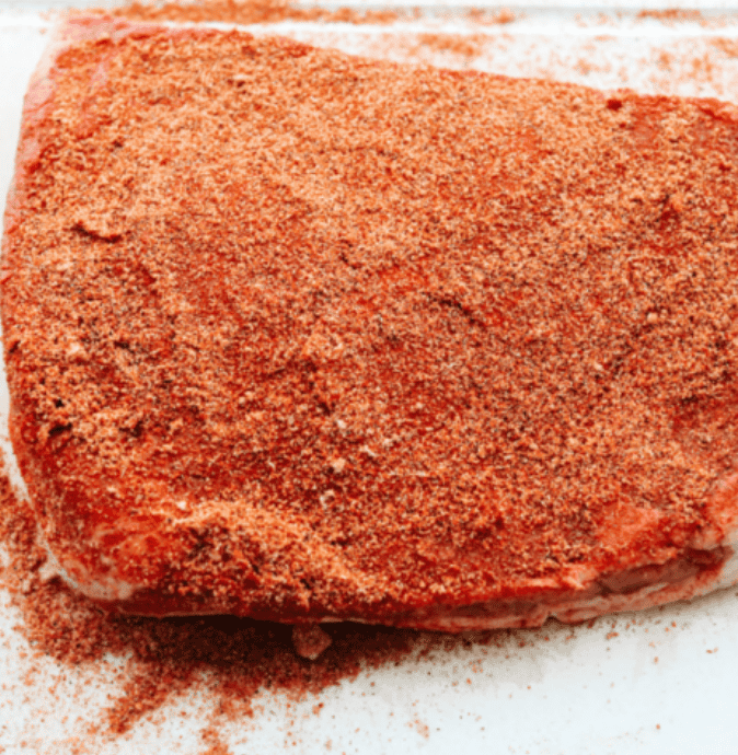 This Slow Cooker Beef Brisket is melt-in-your-mouth tender, packed with flavor, and practically cooks itself. Perfect for easy family dinners or feeding a hungry crowd! Brisket covered in seasoning.