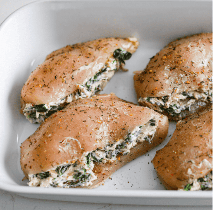 Do you love spinach dip as much as I do? My Spinach Stuffed Chicken Breast turns those creamy, cheesy flavors into an insanely delicious dinner. Quick, easy, and seriously so good. Seasoned chicken breasts stuffed with cream cheese and spinach mixture.