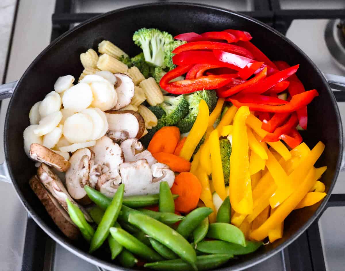 You all love this vegetable stir fry, and I donโt blame you. Itโs fast, flexible, and that sauce? So addicting! Toss in whatever veggies you have and dinnerโs done. Vegetables in a wok.
