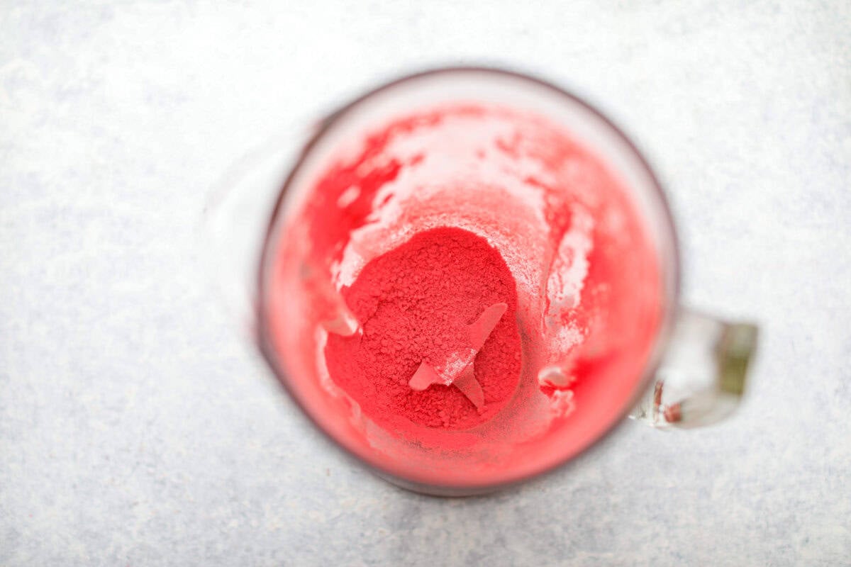 Ever since I discovered the amazing flavors that freeze-dried strawberries add, I’ve been using them as much as possible. This strawberry cake? No exception. And don’t even get me started on the frosting... It’s dangerously good. Freeze dried strawberries in the bottom of a blender all ground up.