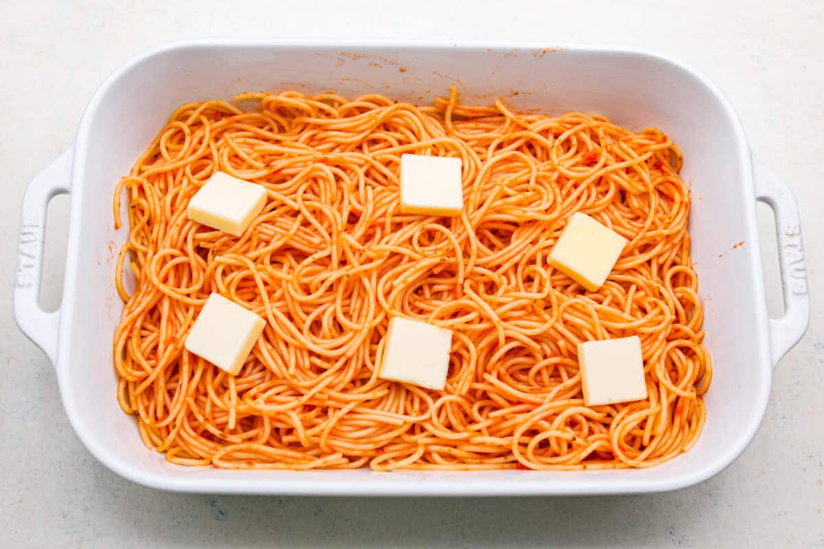 Million Dollar Spaghetti takes baked spaghetti to a whole new level. That cheesy, cream cheese, sour cream, and ricotta layer makes it so dreamy! One bite and you’ll ask, “Wait... why have I not been making spaghetti like this my whole life?” Slices of butter added to the top of the marinara coated noodles.
