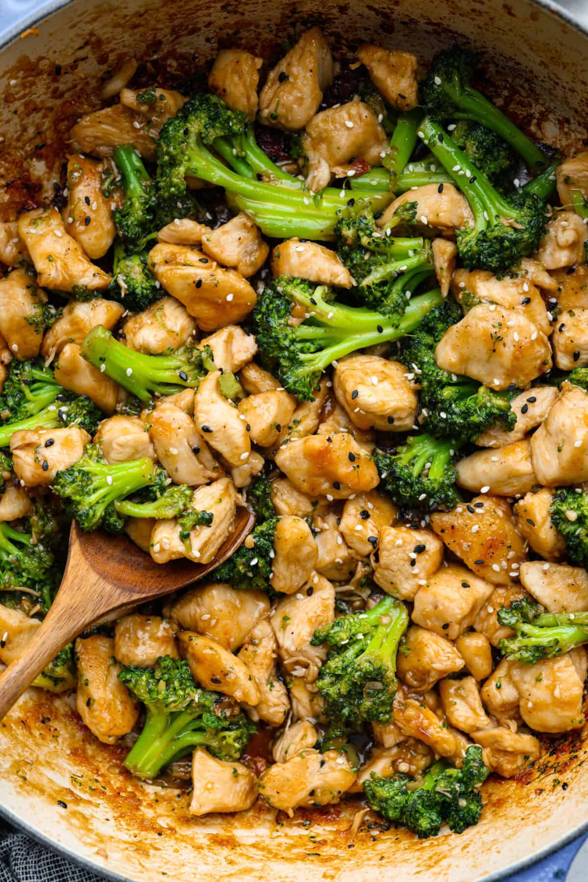 Skillet Sesame Chicken & Broccoli is your new favorite weeknight winner! With sweet and savory flavors in every bite, this easy stir-fry comes together in just 30 minutes. Sauce added and everything stirred together.