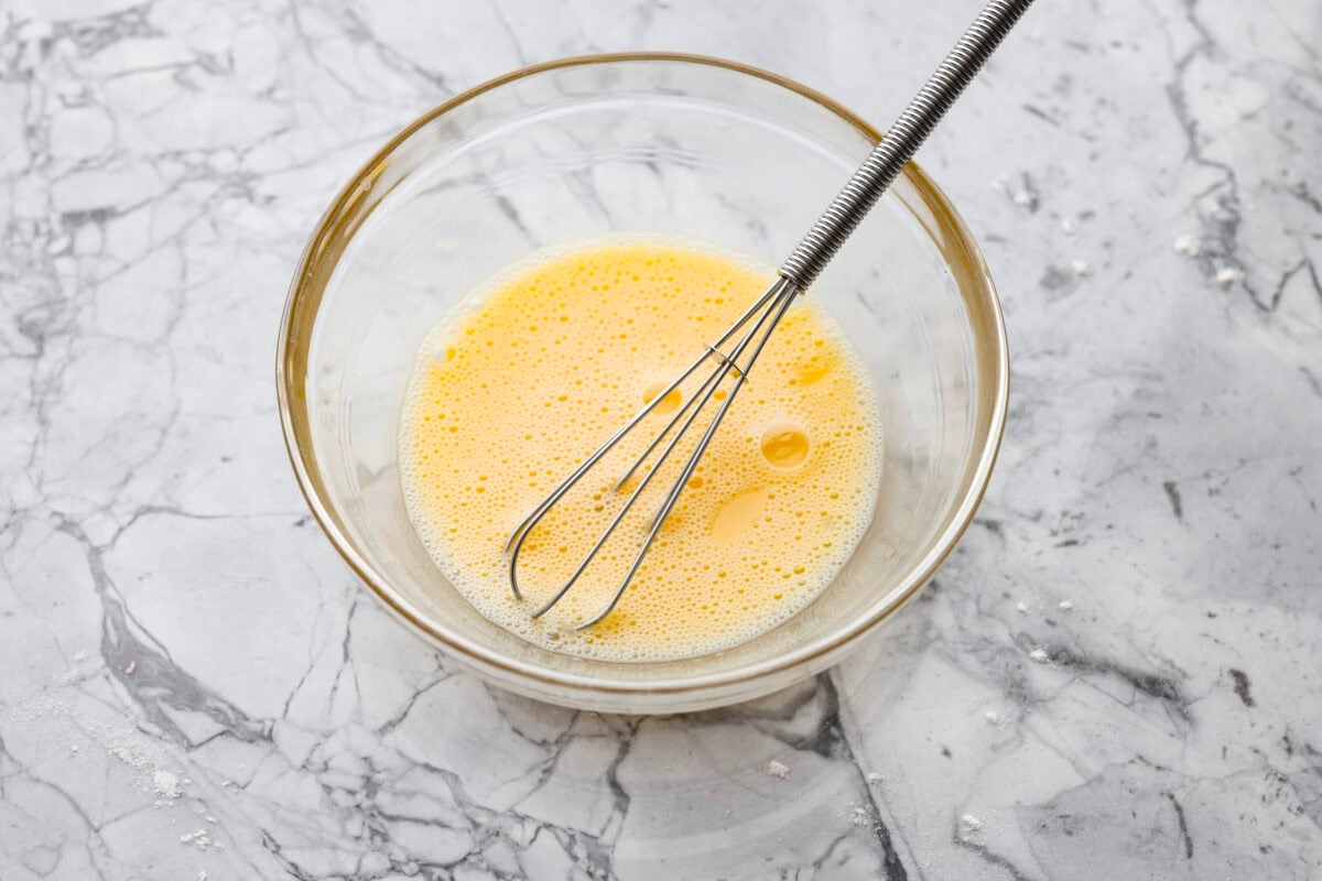 Why make calzones instead of pizza? Sometimes you just want all the pizza vibes without the mess. Calzones are like little pizza presents, warm, cheesy, and you get to make them your way! Egg wash whisked together in a bowl.
