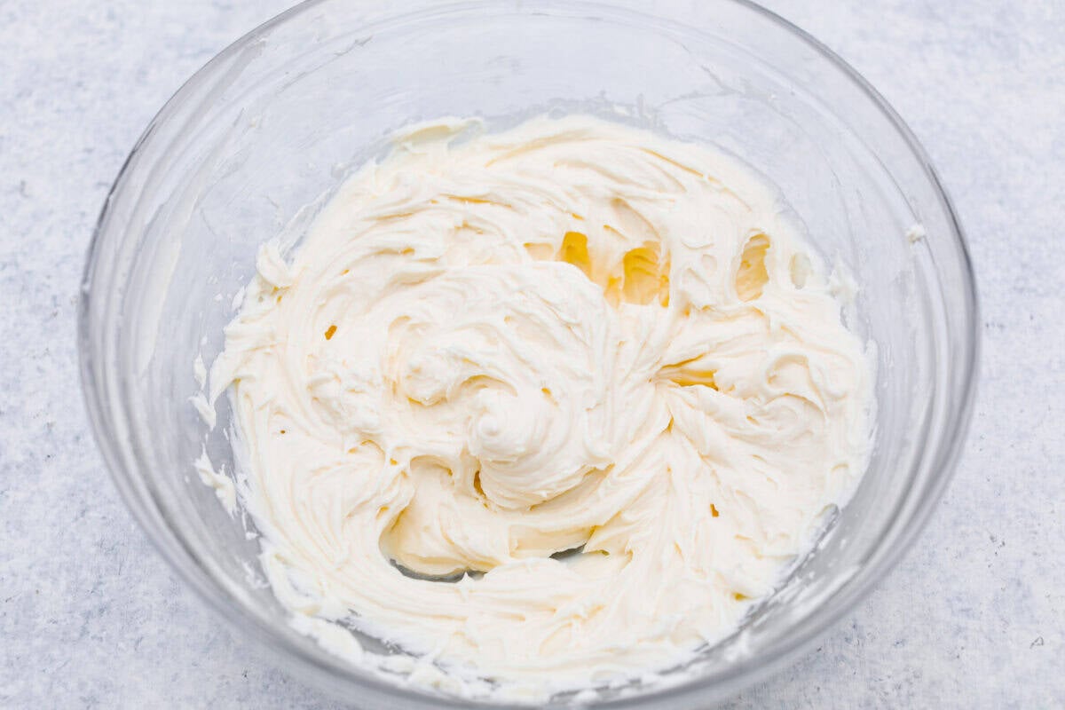 My Dad LOVES coconut cream pie! When I don't have it in me to make a pie, I make this easy Coconut Lush dessert! Itโs rich, dreamy, and always the first dessert to disappear at family gatherings. Cream cheese whipped and mixed.
