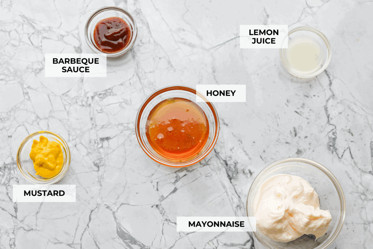 My boys were blowing through bottles of this stuff weekly. Between the price and the junk in it, I said nope and made my own Chick-fil-A Sauce. Itโs smoky, sweet, tangy, creamy magic... and honestly? Way better than the bottle. Overhead shot of labeled ingredients.